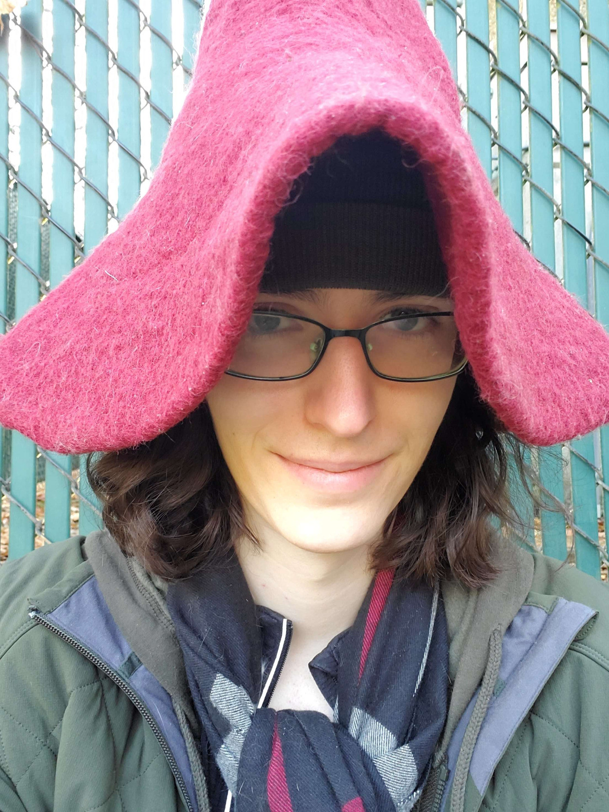 picture of me. I'm wearing a witch hat and a scarf, because this picture was taken when it was colder.  underneath is a beanie to help keep the top hat from sliding all over.