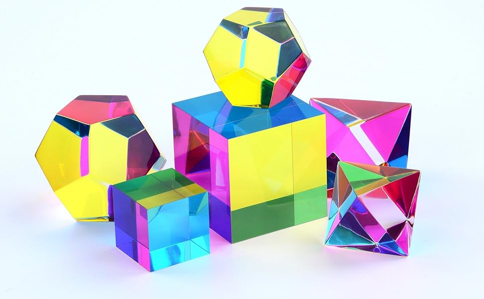 pictures of glass and colored plastic geometric shapes that curve light in certain ways that illustrate some arcane facets of color